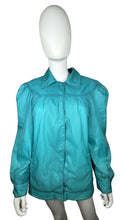 Load image into Gallery viewer, This vintage windbreaker jacket in medium size features a striking teal color and exaggerated shoulders, reminiscent of the bold styles from the 80&#39;s and 90&#39;s. The measurement details are as follows: chest - 41 inches, sleeve - 24 inches, and length -...