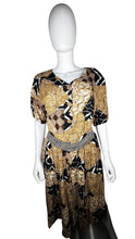 Load image into Gallery viewer, A vintage Norton McNaughton Petites 2-Piece Set with a abstract safari inspired button up short sleeve and skirt. Measured Flat TopChest - 40&quot;Sleeve - 10&quot;Length - 27&quot; Bottom Waist - 30&quot;Hips - 60&quot; Length - 30&quot;
