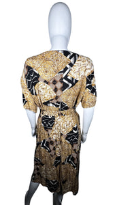 A vintage Norton McNaughton Petites 2-Piece Set with a abstract safari inspired button up short sleeve and skirt. Measured Flat TopChest - 40"Sleeve - 10"Length - 27" Bottom Waist - 30"Hips - 60" Length - 30"