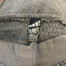 Load image into Gallery viewer, A medium grey jumpsuit without sleeves, featuring an elastic waist and ankles. Made by RND Los Angeles. Dimensions: 28&quot; chest, 20&quot; waist, 40&quot; hips, 25&quot; inseam, and length of 47&quot;.