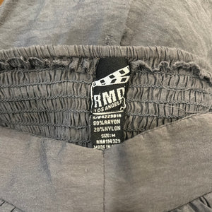 A medium grey jumpsuit without sleeves, featuring an elastic waist and ankles. Made by RND Los Angeles. Dimensions: 28" chest, 20" waist, 40" hips, 25" inseam, and length of 47".