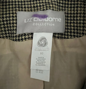 A unique throwback Liz Claiborne collection featuring a luxurious wool tweed suit adorned with houndstooth pattern. This suit comes with a blazer and pants set, with measurements of blazer chest at 30 inches, sleeve at 23 inches, and length at 29.5 inc...
