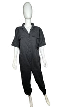 Load image into Gallery viewer, Expertly designed for style and functionality, this Divided jumpsuit is available in a sleek black color and features convenient cargo chest pockets, pant pockets, and belt loops. The precise measurements of this jumpsuit are as follows: Chest - 52&quot;, S...