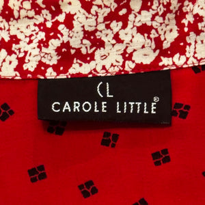 This large vintage Carole Little blazer rocks a bold red color, featuring a peplum bottom, a flowery collar, and charming decorative buttons. When flattened, it measures 42" around the chest, with 22" sleeves, a 26" waist, and a 29" length.