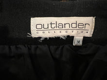 Load image into Gallery viewer, This is a Vintage Outlander Collection Skirt from the 80&#39;s thats a high waisted black skirt with metal gold studs all over that zips in the back. Measured Flat Waist - 28&quot; Hips - 36&quot; Length - 21&quot;