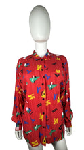 Load image into Gallery viewer, Get ready to unleash your playful side with this quirky Vintage Chaus Button Up! Made from %100 Spun Rayon, this button up features a unique geometric all over print in a bold red color. Perfectly sized at large, the chest measures 34&quot;, sleeve 22&quot;, and...