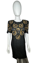 Load image into Gallery viewer, A Vintage Sho-Girl Design 100% pure silk black and gold sequin and beaded dress that zips in the back. Measured FlatChest - 28&quot;Waist - 30&quot;Hips - 34&quot;Length - 40&quot;