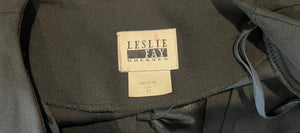 Introducing the Vintage Leslie Fay Black Crop Blazer - the perfect combination of chic and playful! This blazer features a front button closure, satin bow detail, and shoulder pads, along with measurements of 35" chest, 22" sleeves, and 21" length when...