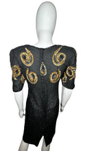 Load image into Gallery viewer, A Vintage Sho-Girl Design 100% pure silk black and gold sequin and beaded dress that zips in the back.   Measured Flat  Chest -  28&quot; Waist -  30&quot; Hips -  34&quot; Length - 40&quot;   