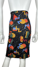 Load image into Gallery viewer, This size small Lularo Shape Skirt features a vibrant geometric print that stretches to fit larger sizes as well (bonus!). When measured flat, it boasts a 28&quot; waist, 34&quot; hips, and is 24&quot; in length. Get ready to turn heads with this playful and versatil...