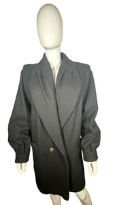 This pristine vintage Donny Brook peacoat is made of rare heavy black wool, featuring magnificent lion head bronze buttons. Measuring at 46 inches across the chest, with 25-inch sleeves and a length of 40 inches, it is a true gem.