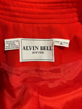 Load image into Gallery viewer, Experience the unique charm of the Vintage Alvin Bell Red Blazer, complete with stunning gold metal button accents on the sleeves and front. Enhance your style with this one-of-a-kind piece that measures 33&quot; in the chest and 22&quot; in the sleeves, with a...