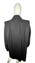 Load image into Gallery viewer, This pristine vintage Donny Brook peacoat is made of rare heavy black wool, featuring magnificent lion head bronze buttons. Measuring at 46 inches across the chest, with 25-inch sleeves and a length of 40 inches, it is a true gem.