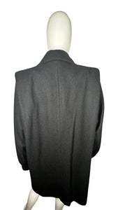 This pristine vintage Donny Brook peacoat is made of rare heavy black wool, featuring magnificent lion head bronze buttons. Measuring at 46 inches across the chest, with 25-inch sleeves and a length of 40 inches, it is a true gem.