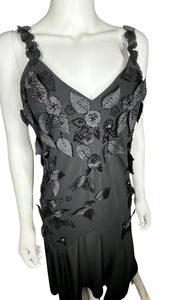 Get ready to turn heads in this sleek R&M Richards formal dress, adorned with intricate black leaf designs. The measurements speak for themselves: 34" flat chest, 28" waist, 35" hips, and a stunning 55" length.