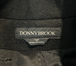 This pristine vintage Donny Brook peacoat is made of rare heavy black wool, featuring magnificent lion head bronze buttons. Measuring at 46 inches across the chest, with 25-inch sleeves and a length of 40 inches, it is a true gem.