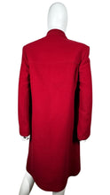 Load image into Gallery viewer, The Vintage KronHaus Coat is a luxurious, bespoke red wool coat. Its unique vintage charm is further enhanced by subtle imperfections near the button zipper area, as shown in the picture. The chest measures 39 inches when laid flat, and the sleeves are...