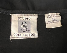 Load image into Gallery viewer, Get ready to bloom with this funky, fab medium black tee from the Studio Collection! With sequins, pearls, and beaded flowers, this vintage-inspired shirt is the perfect mix of whimsy and style.