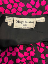 Load image into Gallery viewer, Vintage Oleg Cassini 100% silk bright pink and black peplum top that buttons in the front and has an accordion style back. This is fun well made vibrant top. Measured Flat Chest - 36&quot; Sleeve - 24&quot; Waist - 31&quot;