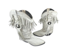 Load image into Gallery viewer, These ACME cowgirl boots from the 80&#39;s are a unique find, with their white color and fringes. While the size is unknown, the boot length measures 10 inches, which typically translates to a size 8 or 9. Since they&#39;re vintage, they may run a bit smaller...