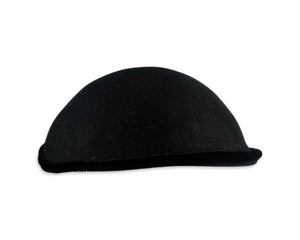 This pillbox hat is a vintage gem, featuring a black velvet design and adorned with a silver and rhinestone brooch. It's Union made and comes in its original box.