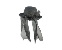 Load image into Gallery viewer, This charming hat features a playful vintage Breton Bumper design, complete with a feather and scarf-like wrap that adds a touch of flair to the back. Although I&#39;m not certain of its age, it measures a perfect 7&quot; in diameter.