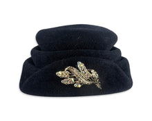 Load image into Gallery viewer, This fab 50&#39;s Pillbox Black Hat boasts a luxurious velvet and wool construction, topped off with a dazzling gold and rhinestone brooch. Measuring 8&quot; in diameter, it&#39;s a stylish nod to the vintage era.