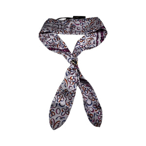 Add a touch of luxury to any outfit with this authentic Louis Vuitton floral silk scarf. The beautiful design and signature gold tie ring make it a versatile accessory for any occasion. Upgrade your style with a touch of French elegance!