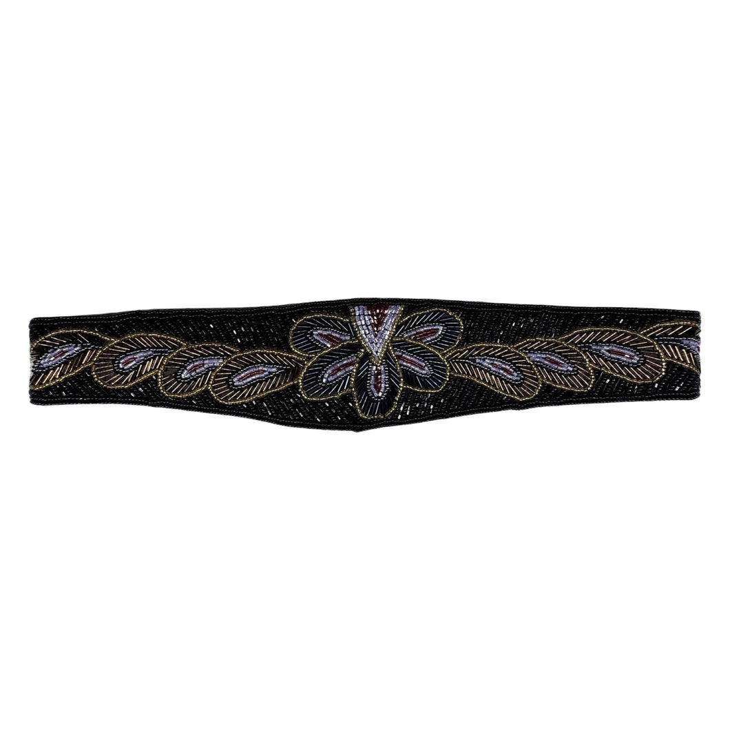 This waist belt is the perfect combo of vintage chic and playful fun! Featuring a black, hand-beaded design with a gleaming iridescent and gold floral pattern, it measures a cool 31 1/2 inches and attaches with a convenient Velcro assembly.
