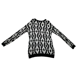 Experience the versatility of our black and white patterned geometric sweater - wear it as a dress with tights underneath or pair it with your favorite bottoms for a stylish look! Measured Flat Chest -36" Sleeve -22" Length -30"