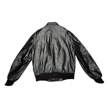 Load image into Gallery viewer, In perfect condition, this Vintage Brown Leather Members Only jacket is a rare find! The zip-up bomber jacket features a unique shoulder collar strap and has chest, sleeve, and length measurements of 40&quot;, 26&quot;, and 28&quot; when laid flat. Don&#39;t miss out on...