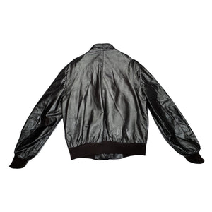 In perfect condition, this Vintage Brown Leather Members Only jacket is a rare find! The zip-up bomber jacket features a unique shoulder collar strap and has chest, sleeve, and length measurements of 40", 26", and 28" when laid flat. Don't miss out on...