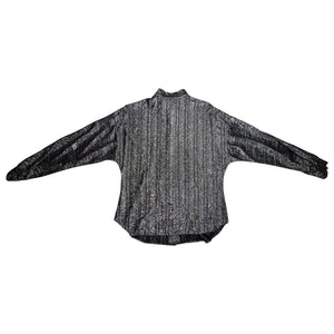 Experience the ultimate 70's vibe with this shiny sparkly Lame' lurex fabric silver button party top from Judy Bond. Don't let the pictures deceive you, it's even better in person. Measured Flat Chest - 38" Sleeve - 25" Waist - Length - 29".