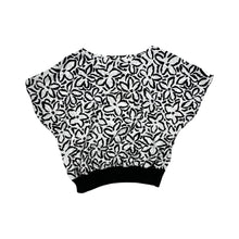 Load image into Gallery viewer, A vintage black and white all over floral print shirt by Rhoda Lee. Measured Flat Chest - 48&quot; Waist - 44&quot; Length - 22&quot;