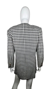 This vintage Leslie Fay blazer boasts a plaid pattern and comes with a permanent red hanky in the pocket. The chest measures 38 inches, the sleeves are 22 inches, and the length is 31 inches.