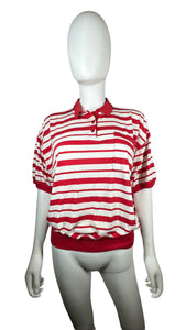 Experience classic style with this Vintage Karen Scott polo featuring red and white stripes and a convenient cigarette pocket. Its flattering fit measures 44" in the chest, with 8" sleeves and a length of 21 1/2".&nbsp;  &nbsp;