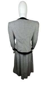 This posh Vintage Jessica Howard by Mitchell Rodbell suit features a charming houndstooth blazer with shoulder pads and a matching skirt. Measurements when laid out flat include 32" for the top chest and 21" for the sleeves, with a length of 23". The bottom waist measures 26" and the hips are a generous 44" with a length of 31".
