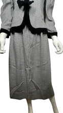 Load image into Gallery viewer, This posh Vintage Jessica Howard by Mitchell Rodbell suit features a charming houndstooth blazer with shoulder pads and a matching skirt. Measurements when laid out flat include 32&quot; for the top chest and 21&quot; for the sleeves, with a length of 23&quot;. The bottom waist measures 26&quot; and the hips are a generous 44&quot; with a length of 31&quot;.