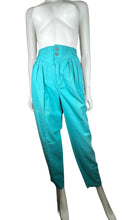 Load image into Gallery viewer, The Vintage Liz Wear Teal Pant is a rare and delightful find, boasting a vibrant color and a playful 3-button design. With a zipper closure, this pant is both fun and functional. It measures a flat waist of 24 inches, with hips of 42 inches, and an inseam of 30 inches. Plus, with a length of 41 inches, you&#39;ll want to strut your stuff in these stylish and unique pants.  &nbsp;