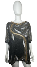 Load image into Gallery viewer, Get ready to shine with this Vintage Jennifer Joseph Lebon top that doubles as an oversized dress! The sequins and beads add a touch of glam, and it measures at a comfortable chest size of 46 inches with 11 1/2 inch sleeves and a 29 inch length.