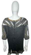 Load image into Gallery viewer, Get ready to shine with this Vintage Jennifer Joseph Lebon top that doubles as an oversized dress! The sequins and beads add a touch of glam, and it measures at a comfortable chest size of 46 inches with 11 1/2 inch sleeves and a 29 inch length.