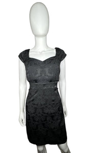 Black cocktail dress with cap sleeves, filagree pattern and cut outs on the sides. Measured Flat Chest - 34" Waist - 30" Hips - 34" Length - 35 1/2"