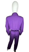 Load image into Gallery viewer, This rare find Vintage 80&#39;s Saint Germain Jumpsuit is a vintage purple button up jumpsuit with gold stitching and embellishing with a stretch waist. Measured Flat Sleeve - 24&quot; Waist - 26&quot; Hips - 36&quot; Length - 58&quot;