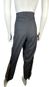 Vintage 80s Varda Garfinkel Black Pant is a black pant with zipper as well as black and gold leg embellishments. Measured Flat Waist - 32" Hips - 38" Length - 41"