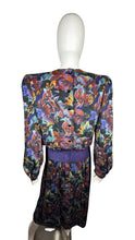 Load image into Gallery viewer, Vintage Patty O&#39;neil by Monique Robidoux Floral Dress is a purple long sleeve dress with an all over floral print and built in suede belt. Measured Flat Chest - 38&quot; Sleeve - 25&quot; Waist - 26&quot; Hips - 34&quot; Length - 49&quot;