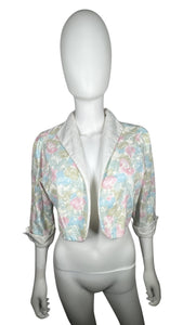 Pastel floral print crop jacket. Its a vintage size 10 so it runs smaller. Measured Flat Chest - 36" Sleeve - 16 1/2" Length - 17"