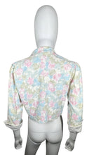 Load image into Gallery viewer, Pastel floral print crop jacket. Its a vintage size 10 so it runs smaller. Measured Flat Chest - 36&quot; Sleeve - 16 1/2&quot; Length - 17&quot;