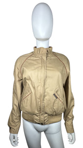 This Vintage Members Only Jacket comes in a beautiful tan and brown color and features a reversible zip-up design with two buttons. Measured Flat Chest - 32" Sleeve - 24" Length - 24".