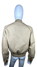 Load image into Gallery viewer, This Vintage Members Only Jacket comes in a beautiful tan and brown color and features a reversible zip-up design with two buttons. Measured Flat Chest - 32&quot; Sleeve - 24&quot; Length - 24&quot;.