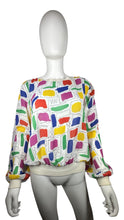 Load image into Gallery viewer, This Vintage Gailord 80&#39;s top boasts colorful sheer material and playful shapes all over. Measured flat, it has a chest of 36&quot;, sleeves of 25&quot;, and a length of 21&quot;.